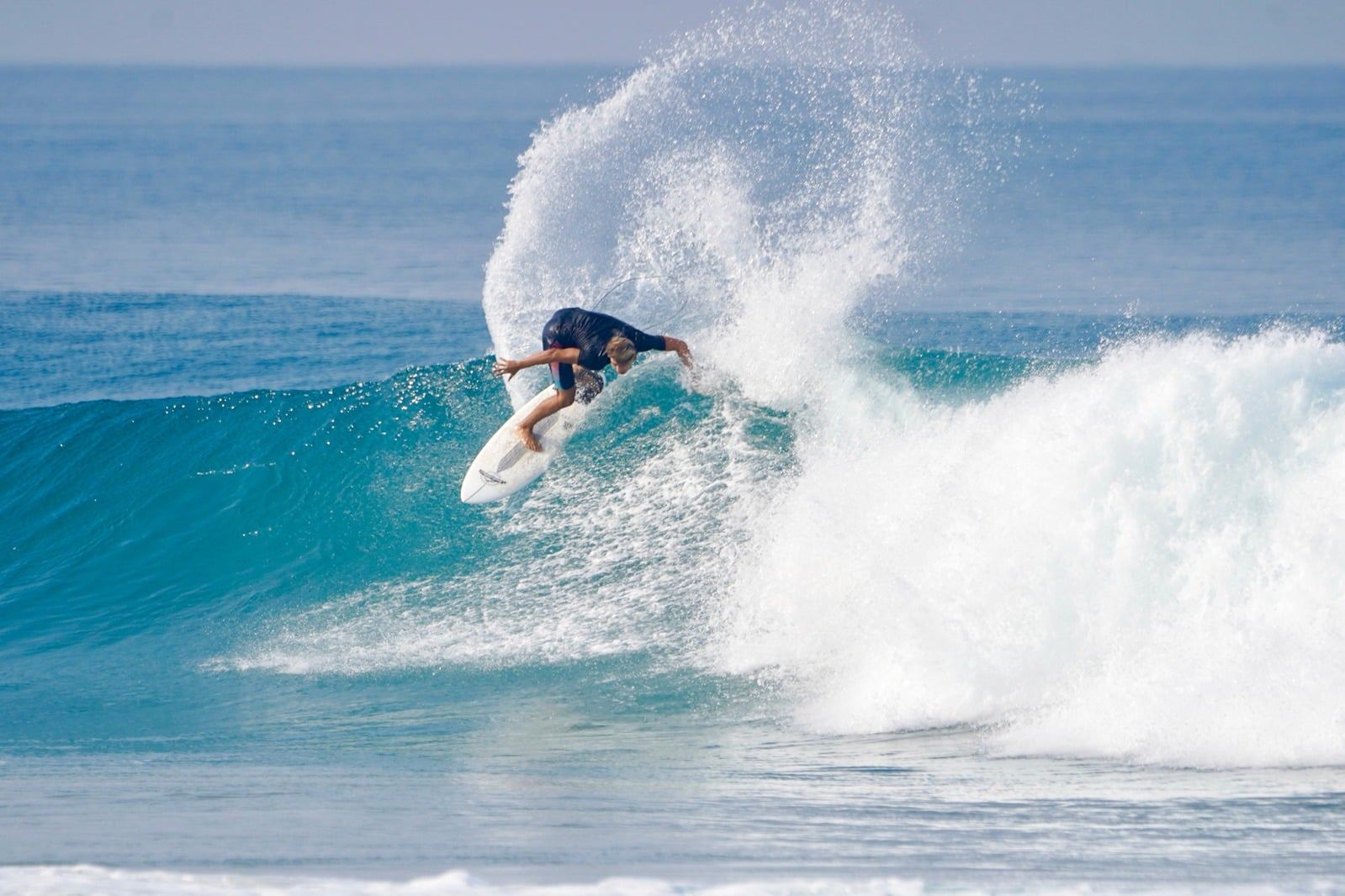 Surfer throwing spray on a turn in Santa Teresa