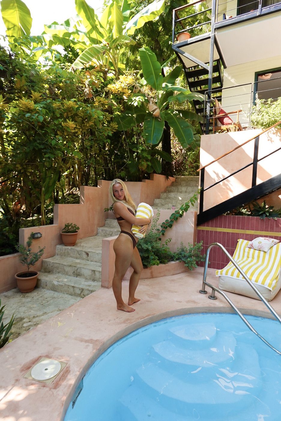 Pool and garden steps surrounded by jungle plants